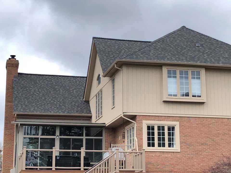 Side view of a newly installed brown roof on residential home