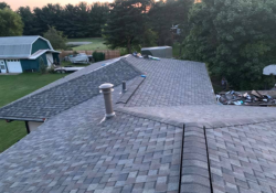 Experienced Shelby Township roofing contractor inspecting a residential roof to ensure quality and durability.